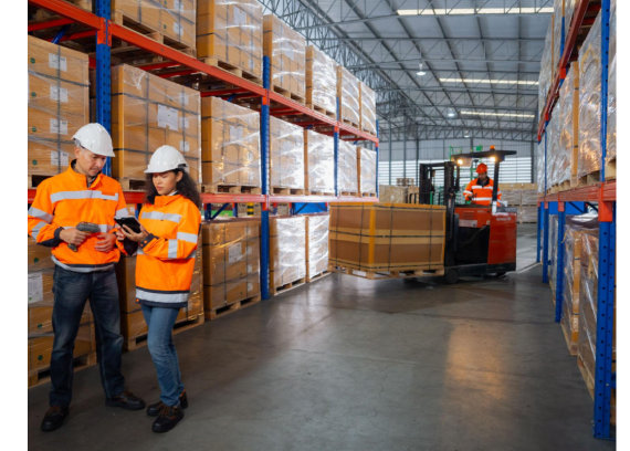 Warehouse staff coordinating goods movement